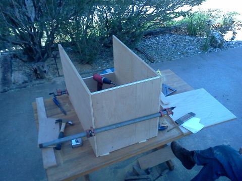 1996 Ford Bronco - Woodworking project in progress, showing a partially built box with tools and clamps.