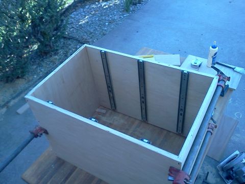 1996 Ford Bronco - A wooden box is being constructed with drawer slides attached to the interior sides.