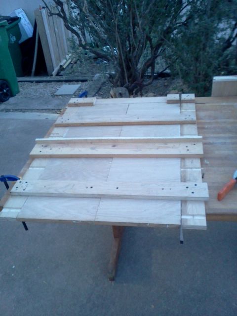 1996 Ford Bronco - A wooden bench is being constructed on a table, with various pieces of wood and tools present.