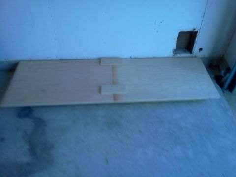 1996 Ford Bronco - A wooden panel with two blocks attached, demonstrating a joinery technique.