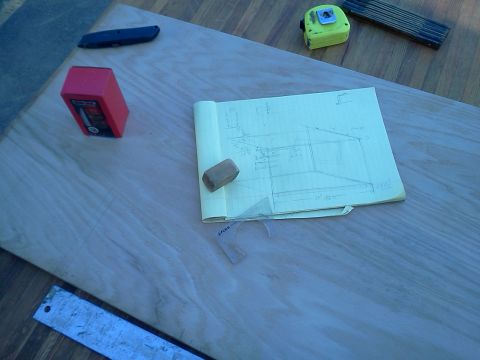 1996 Ford Bronco - Tools and a sketch are laid out on a wooden surface, suggesting a project in progress.