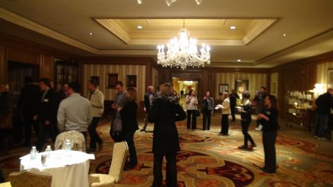 1993 Ford Taurus - A gathering of people in an indoor venue with ornate decor.
