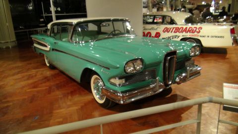 1993 Ford Taurus - A teal and white 1958 Edsel Pacer is displayed indoors, with another vehicle visible in the background.