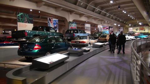 1993 Ford Taurus - A museum exhibit displays various vehicles from different eras, with a focus on automotive history.