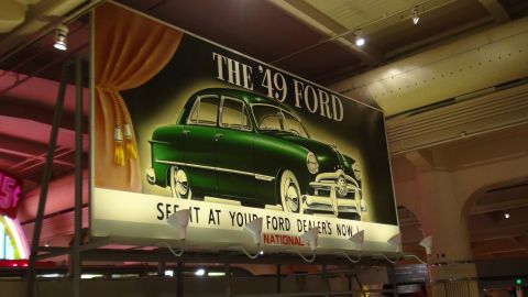 1993 Ford Taurus - Advertisement for the 1949 Ford, showing a green sedan and text reading 'See it at your Ford dealers now'.
