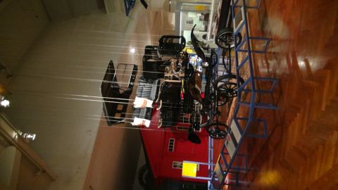 1993 Ford Taurus - This antique fire engine is displayed indoors, likely in a museum setting.
