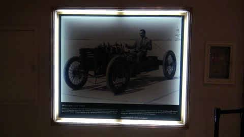 1993 Ford Taurus - William Clay Ford is pictured in a race car, likely from the early 1900s, based on the text below the image.
