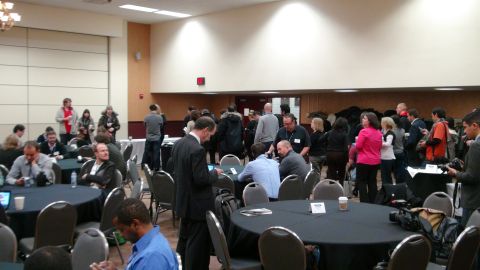 1993 Ford Taurus - Attendees network and interact in a conference room setting during an event.