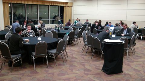 1993 Ford Taurus - People attend a conference or meeting in a large room with many tables and chairs.