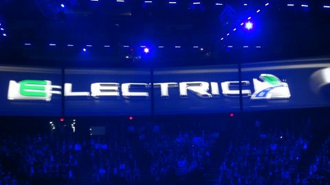1993 Ford Taurus - A large screen displays the word ELECTRIC with a stylized 'e' and a graphic of an electric vehicle.