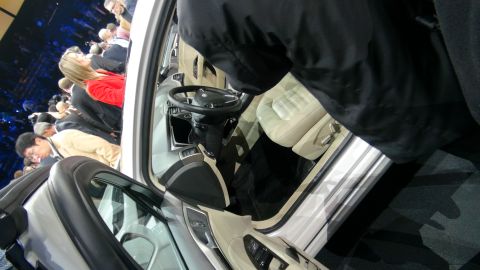 1993 Ford Taurus - View of a car's interior, showing seats and dashboard, with a crowd in the background.