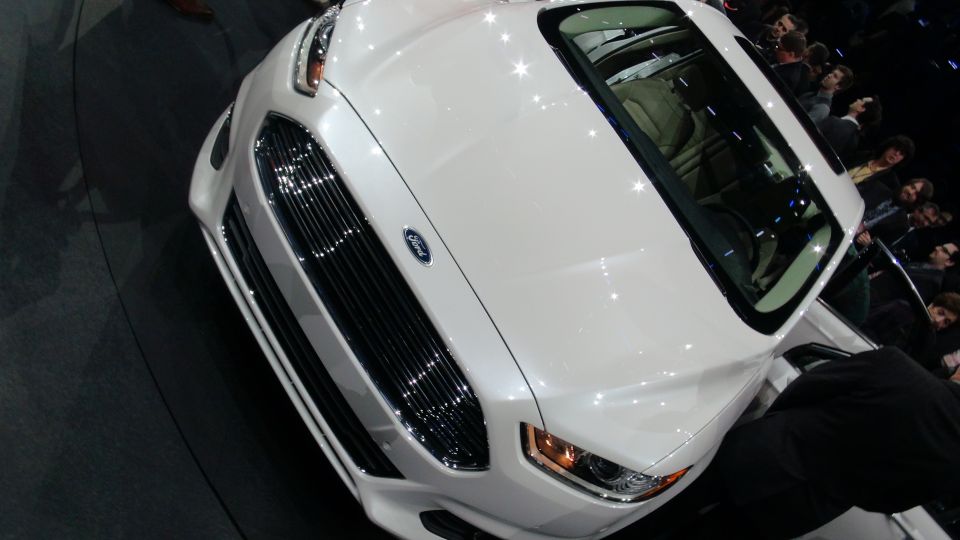 White Ford sedan front grille and headlights