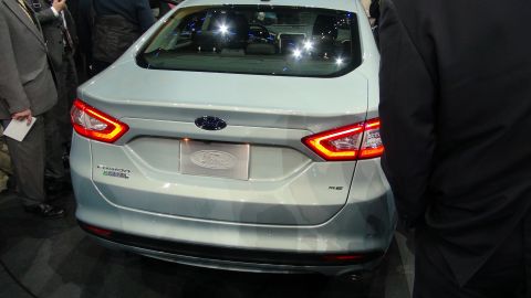 1993 Ford Taurus - Light blue Ford Fusion shown from the rear at an auto show.