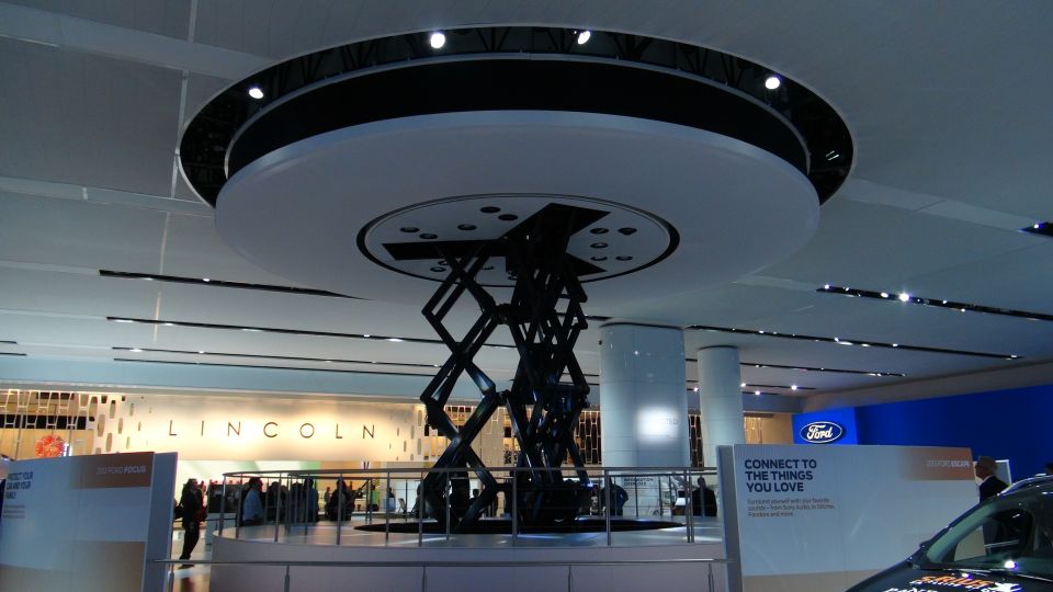 Ford display with scissor lift and 'Connect to the Things You Love' sign