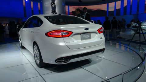 1993 Ford Taurus - The rear of a white Ford Fusion is displayed, its signature taillights and model nameplate.