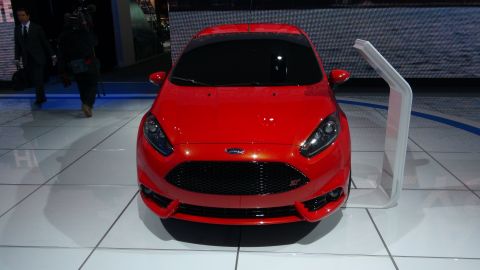 1993 Ford Taurus - Front view of a red Ford Fiesta ST on display at an auto show.