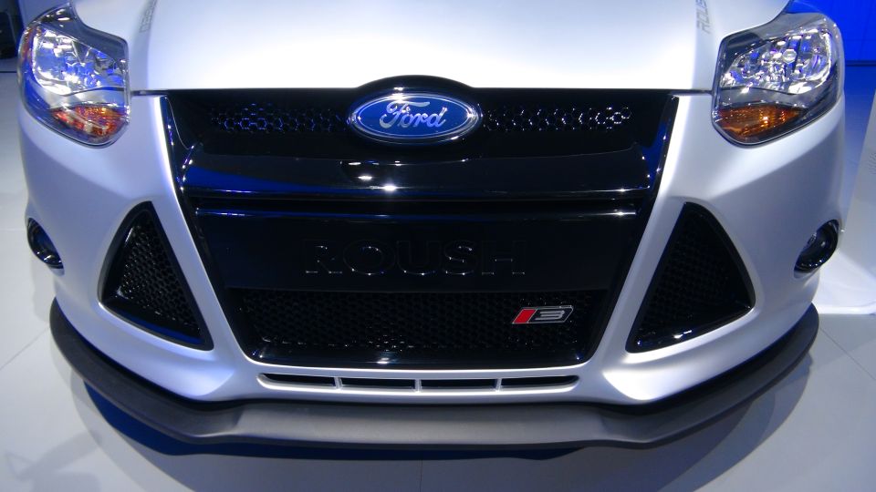 Silver car front view with Ford badge and 'Focus' text on grille