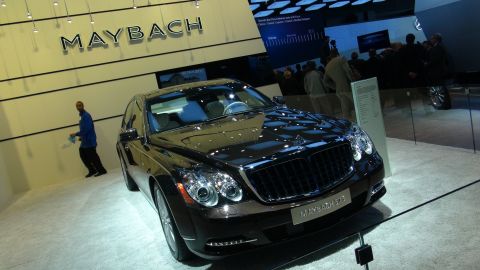 1993 Ford Taurus - A Maybach 57S is displayed at an auto show, with the Maybach logo visible on the wall.