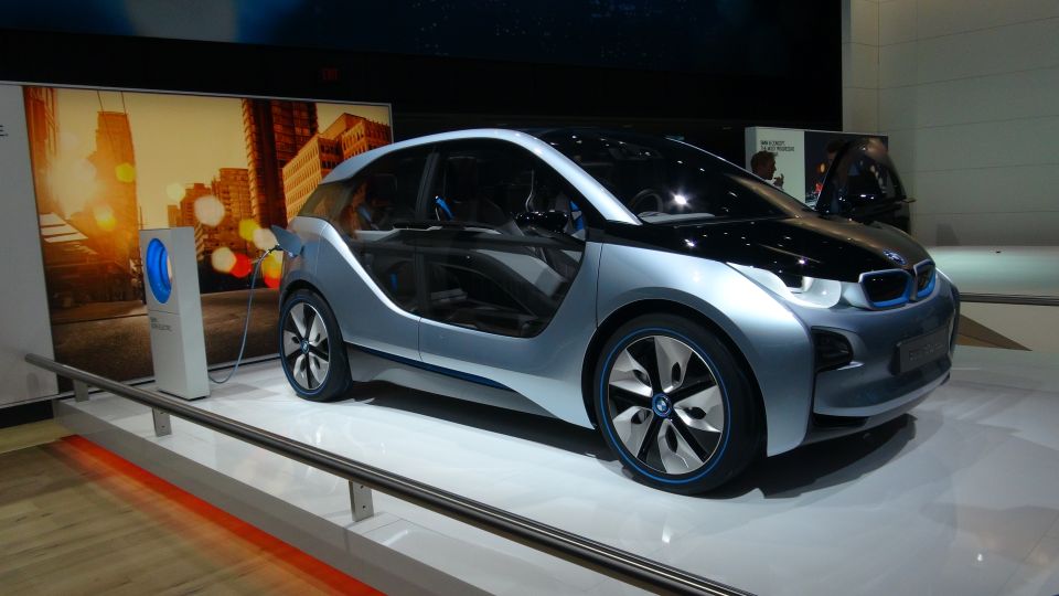 BMW i3 concept electric car plugged into charging station