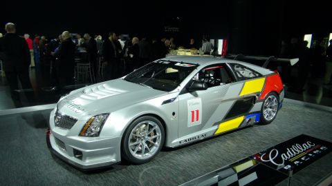 1993 Ford Taurus - Cadillac Racing car displayed with colorful racing graphics and sponsor logos.