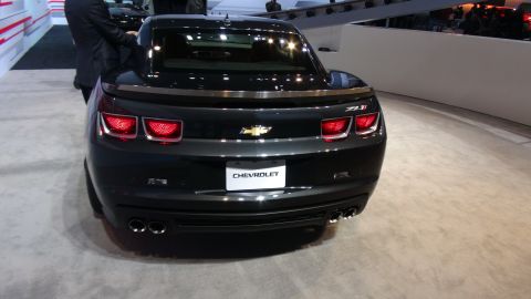 1993 Ford Taurus - Rear view of a dark grey Chevrolet Camaro ZL1, identified by its ZL1 badging and distinctive quad exhaust pipes.