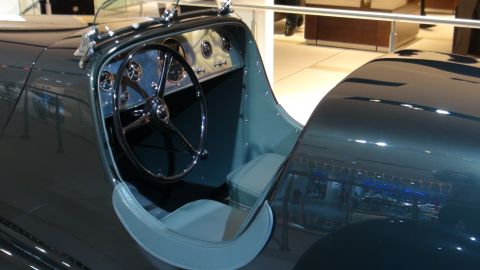 1993 Ford Taurus - Interior view of a classic automobile, a large steering wheel and multiple gauges on the dashboard.