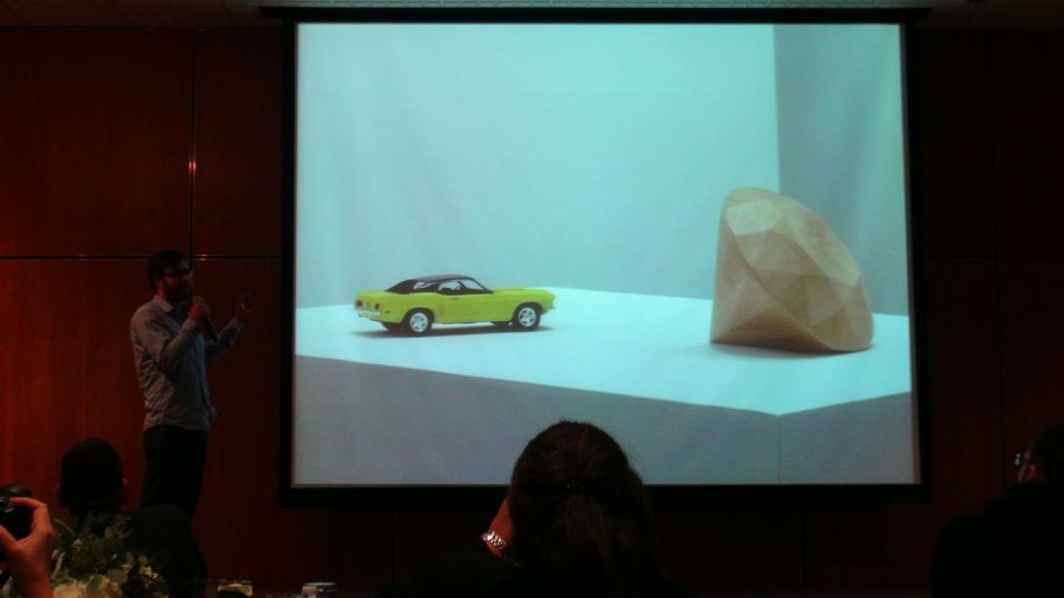 Yellow toy car with black roof and interior, side view