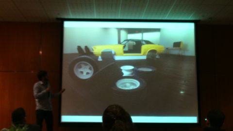 1993 Ford Taurus - A yellow car is displayed with its doors open and wheels removed.