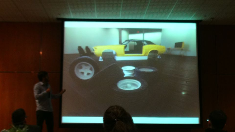 Yellow car with doors open, missing wheels, on display