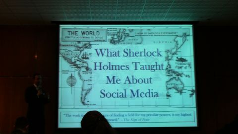 1993 Ford Taurus - Presentation slide displays a world map and text about Sherlock Holmes and social media.