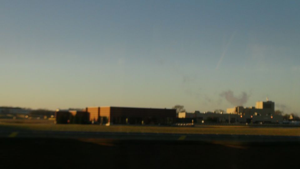 Buildings under a clear blue sky at sunset