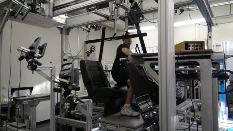 1993 Ford Taurus - A person is seated in a device surrounded by motion capture equipment and cameras.