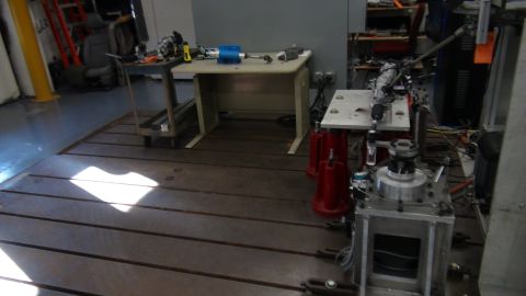 1993 Ford Taurus - A workshop environment with various pieces of industrial equipment and a workbench.