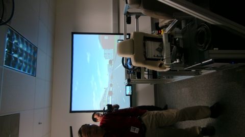 1993 Ford Taurus - A driving simulator is set up with a screen showing a road scene.