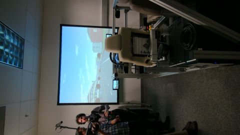 1993 Ford Taurus - A driving simulator setup is shown with a projection screen displaying a road.