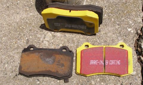 2010 Hyundai Genesis - A comparison of a worn brake pad and new EBC Yellowstuff brake pads with a brake-in coating.