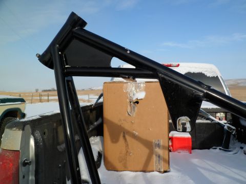 1973 Harley-Davidson Ultra - Roll cage and box loaded in a pickup truck bed during winter.