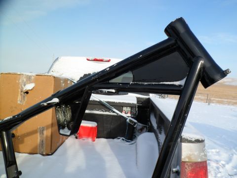 1973 Harley-Davidson Ultra - Roll cage and cargo in a snow-covered pickup truck bed.