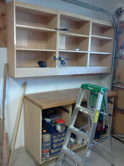 1996 Ford Bronco - A garage scene shows a workbench and shelving unit, with a ladder in the foreground.
