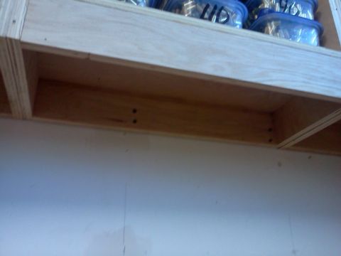 1996 Ford Bronco - Storage shelf with plastic containers and Supermotors.net logo visible.
