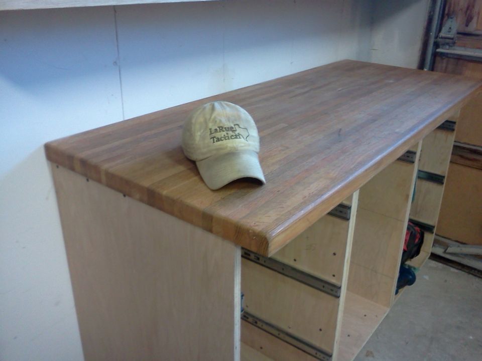 Workbench with a tan baseball cap that has 'LaRue Tactical' text