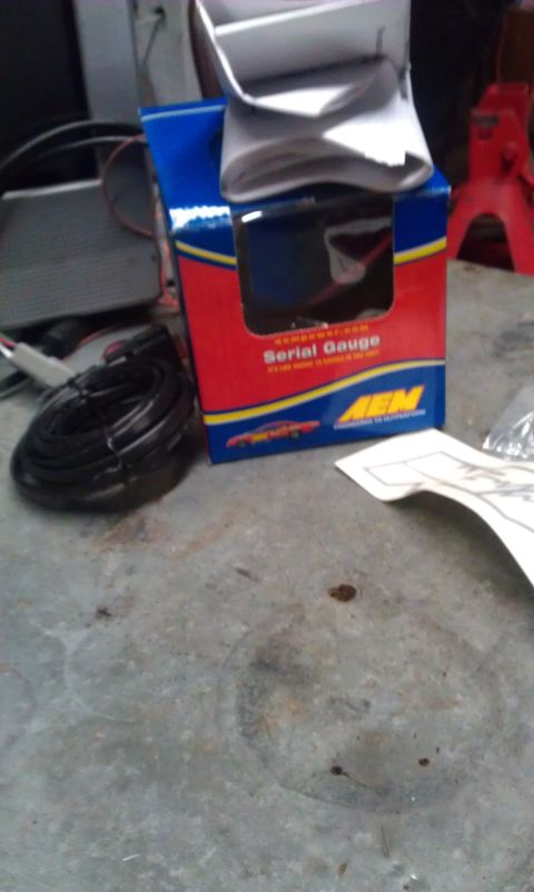 1995 Honda Civic - The photo shows an AEM Serial Gauge box and associated wiring, not a 1995 Honda Civic.