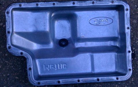 1993 Ford Bronco - I usually clean out the pan and make sure there is not gasket left while the rest of the transmission fluid drips from the bottom into the…