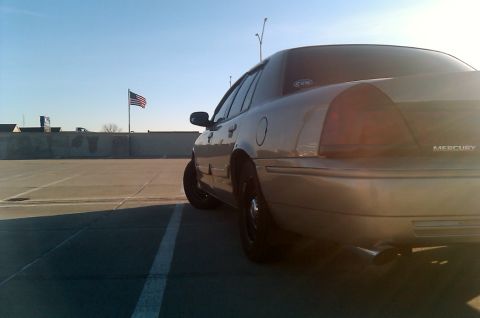 2000 Mercury Grand Marquis - Rear view of a 2000 Mercury Grand Marquis parked outdoors under a clear sky.