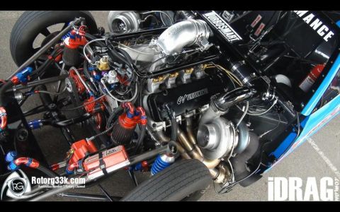 1965 Ford Fairlane - A highly modified engine, likely for drag racing, is shown with twin turbochargers and extensive custom plumbing.