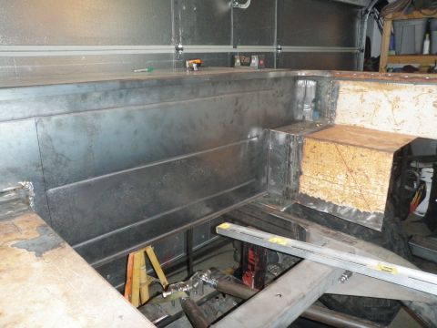 1961 International Scout 800 - The interior of a vehicle is shown during a construction or modification phase, with exposed metal and unfinished surfaces.