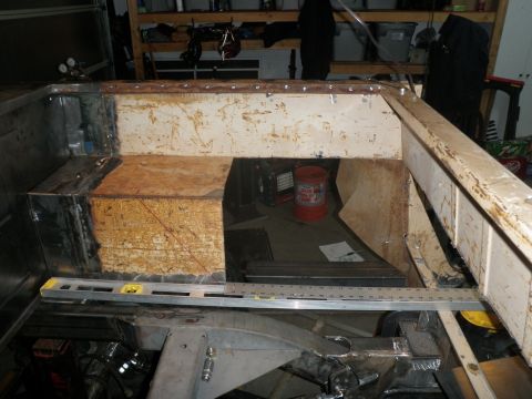 1961 International Scout 800 - Work in progress on a vehicle's frame and body structure, showing construction elements.