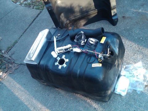 1987 Ford Bronco - A new fuel tank assembly, including the fuel pump and sender unit, is ready for installation.