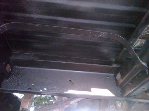 1987 Ford Bronco - The underside of a vehicle frame is visible, with a Supermotors.net logo in the corner.