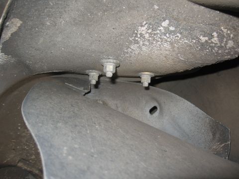 1994 Ford Bronco - Close-up view of the underside of a vehicle, showing mounting bolts on the frame.